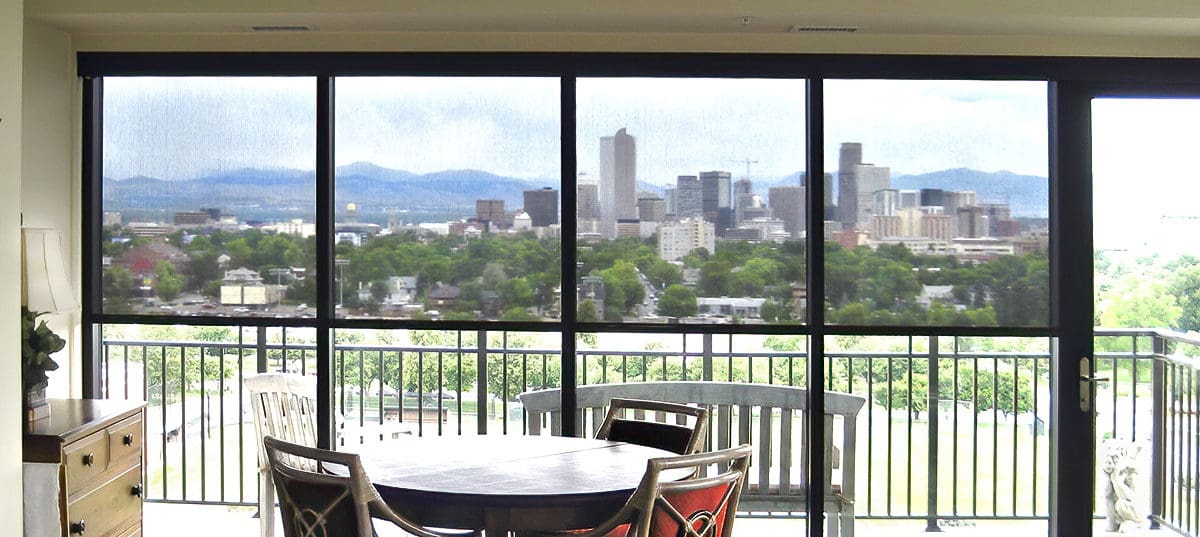 Insolroll motorized solar shades Denver skyline