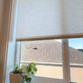 cream linen custom roller shades in kitchen