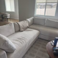cream linen custom roller shades in living room